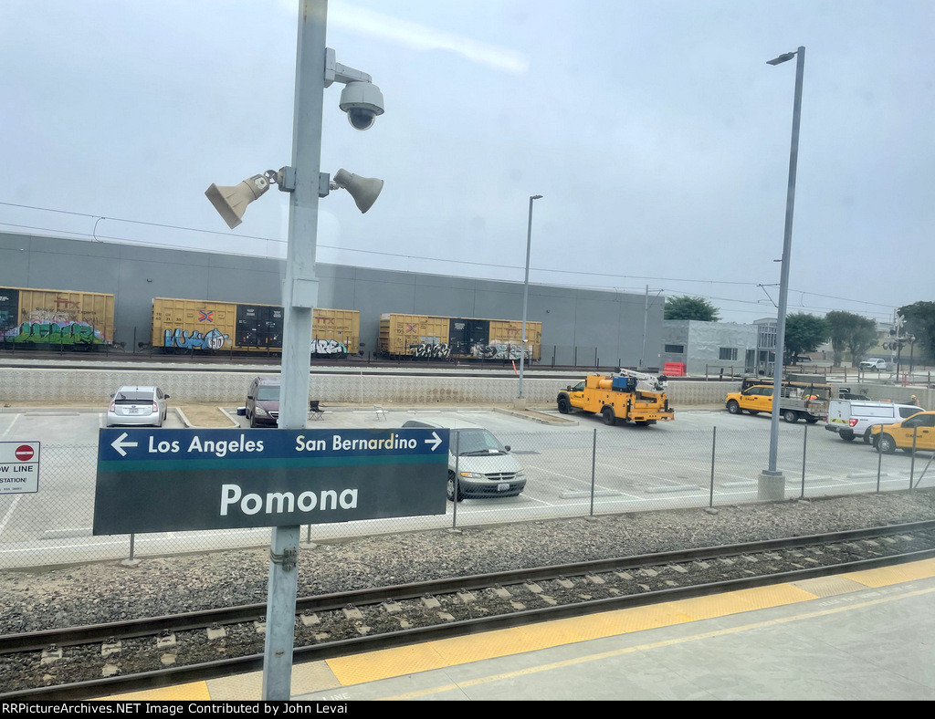 Pomona North Station-catenary towers in the background belong to the future LACMTA A Line light rail route extension to and from Montclair